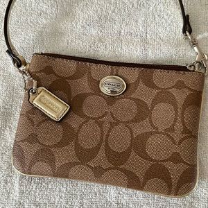 Coach brown and tan wristlet